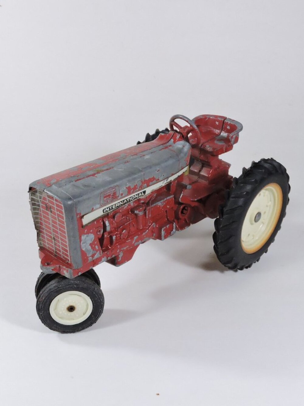 Vintage Cast Metal Farm Tractor - International - Die Cast Toy With Wear